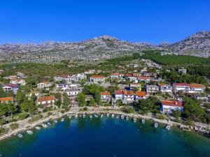 an aerial view of a town with boats in the water at Villa Mungo in Starigrad-Paklenica