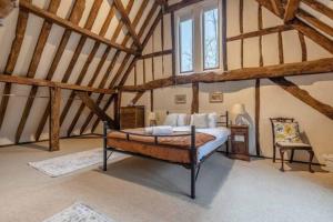 a bedroom with a bed in a attic at Family Friendly Retreat Dorney,Windsor in Buckinghamshire