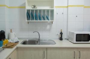 Kuchyň nebo kuchyňský kout v ubytování WakeUp SevillaApartment