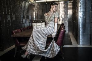 a woman sitting on a chair in a room at Hotel Gotham in Manchester