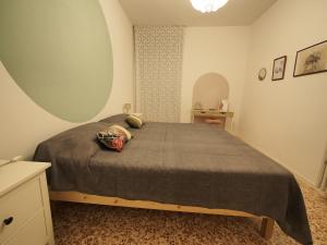 a bedroom with a large bed in a room at From Pedrotti in Desenzano del Garda