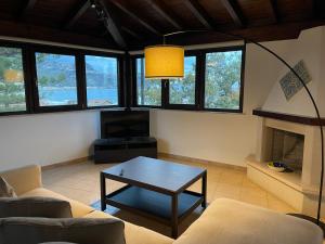 a living room with a couch and a coffee table at John Sea Suites in Giardini Naxos