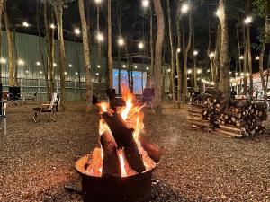 a fire pit in a courtyard at night at Qilin Valley in Puli