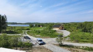 an aerial view of a house and a truck parked in a driveway at Torghatten bnb in Brønnøysund