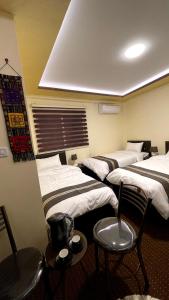 Кровать или кровати в номере Ad Deir Guesthouse