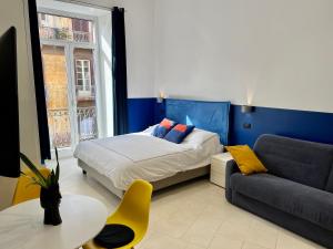 A bed or beds in a room at Duomo Inn Apartments