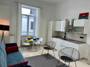 A kitchen or kitchenette at Duomo Inn Apartments
