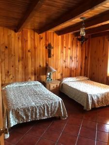 Cama o camas de una habitación en Cabañas Lupita