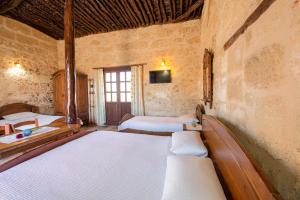 Postel nebo postele na pokoji v ubytování Revaklı Ev Guest House + 37 fotografií