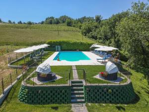 an overhead view of a swimming pool in a field at Vigna Dell'Acqua in Santo Stefano Belbo