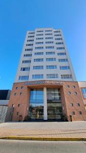 a tall building with a sign on the front of it at Hotel Diego de Almagro Curicó in Curicó
