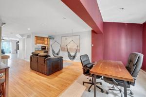 a living room with a wooden table and chairs at Society Hill 4 Bedroom with Garage Parking in Philadelphia