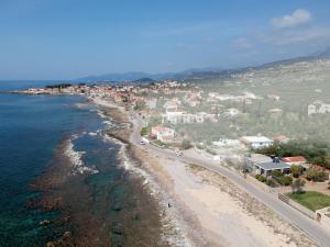 an aerial view of a beach and the ocean at Bostani Seaside House Mani in Agios Nikolaos