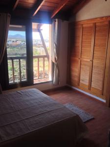 Postel nebo postele na pokoji v ubytování Villa en zona tranquila de Lajares VISTA CALMA + 16 fotografií