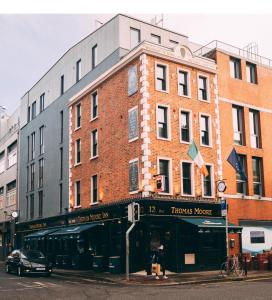 a building on the corner of a city street at Thomas Moore Inn in Dublin