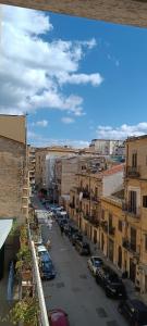 a city street with parked cars and buildings at Mi Tierra Luxury Apartments in Palermo