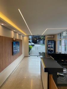 a large kitchen with a counter and a view of a parking lot at Hotel Solar Paulista in Sao Paulo