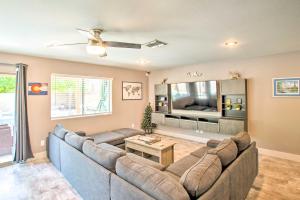 a living room with two couches and a tv at Modern Phoenix Haven with Private Pool and Patio! in Phoenix