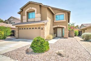 a house with a garage in front of it at Modern Phoenix Haven with Private Pool and Patio! in Phoenix