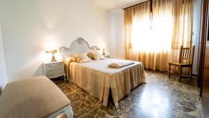 Giường trong phòng chung tại Casa, playa y jardín