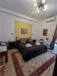 a bedroom with a bed and a table and chairs at B&B Divina Roma in Rome