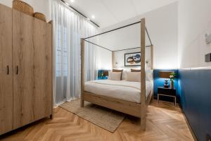 a bedroom with a canopy bed in a room at The Couper Castello in Milan