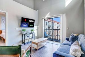 a living room with a couch and a table at Space for 8 Near Downtown Easy Walk to UT Campus in Austin