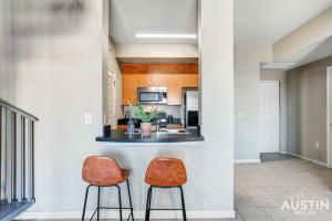 a kitchen with two chairs and a counter at Space for 8 Near Downtown Easy Walk to UT Campus in Austin
