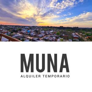 a view of a city with the numa columbia temota logo at MUNA in Concepción del Uruguay