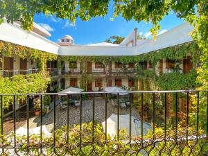 an outdoor view of a building with ivy at El Carmen Suites in Antigua Guatemala