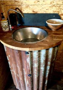 a stainless steel sink in a wooden counter top at Field Hut in Wadebridge