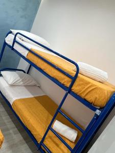 a couple of bunk beds in a room at Garden green da VIRNA in Torre Annunziata +147 photos