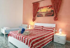 A bed or beds in a room at Appartamenti Blue House