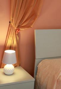 A bed or beds in a room at Appartamenti Blue House