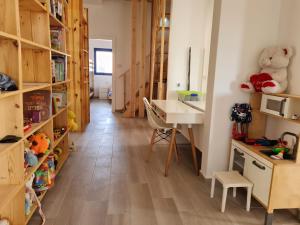 a room with a desk and a table in a room at Yvonne's Home Sde Boker in Midreshet Ben Gurion