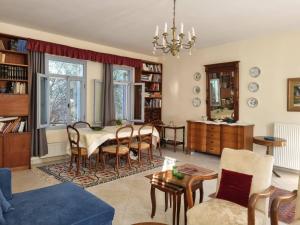 a living room with a dining room table and chairs at Margouno Eco-Villa, Eggares, Naxos in Eggares