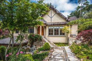 a house with a stone path leading to the front door at 3770 Stone's Throw home in Carmel