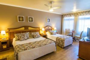 Cama ou camas em um quarto em Hotel Recanto da Serra