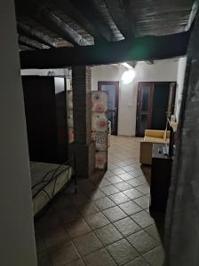 a room with a room with beds and a room with a room at La Corte dei Celti in San Benedetto Del Querceto