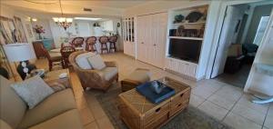 a living room with a couch and a tv at Saida I Condos S1206 in South Padre Island