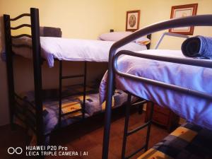A bed or beds in a room at LOS ABUELOS