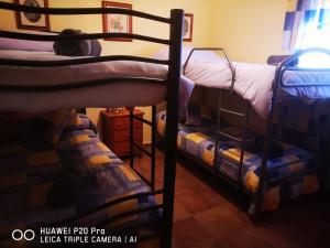 A bed or beds in a room at LOS ABUELOS