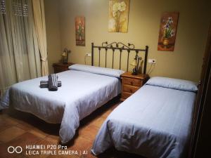 A bed or beds in a room at LOS ABUELOS