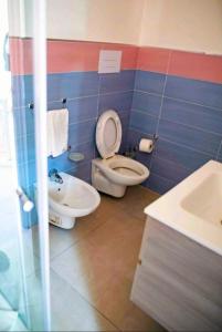 a bathroom with a toilet and a sink at SANT'ANTIDA APARTMENT in Caserta +6 photos