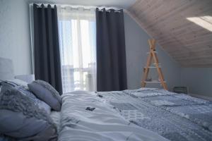Posteľ alebo postele v izbe v ubytovaní Apartament u Sikorki