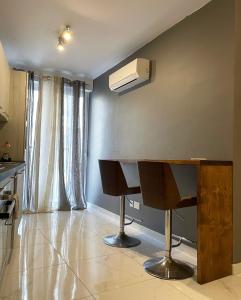 a room with a desk and a air conditioner on the wall at Stylish 1 bedroom apartment in central Msida C11A in Msida