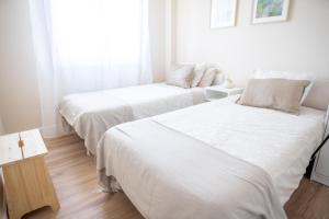 Кровать или кровати в номере SAMIL PLAYA SUR