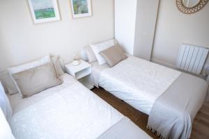 Кровать или кровати в номере SAMIL PLAYA SUR