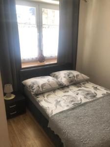 Posteľ alebo postele v izbe v ubytovaní Apartament Stroma 4