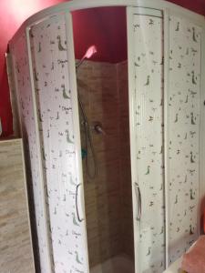 a bathroom with a shower with a climbing wall at Loft 70 in Montescudaio +11 photos